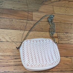 One main pocket, small mini pocket. Gold chain.